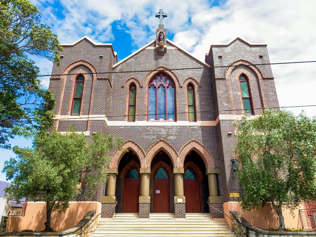 A low angle view of the Gothic facade of St Peter's Church in Surry Hills, Australia.